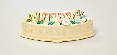Buy stock photo Shot of various teeth cleaning tools on a table in a dentist’s office