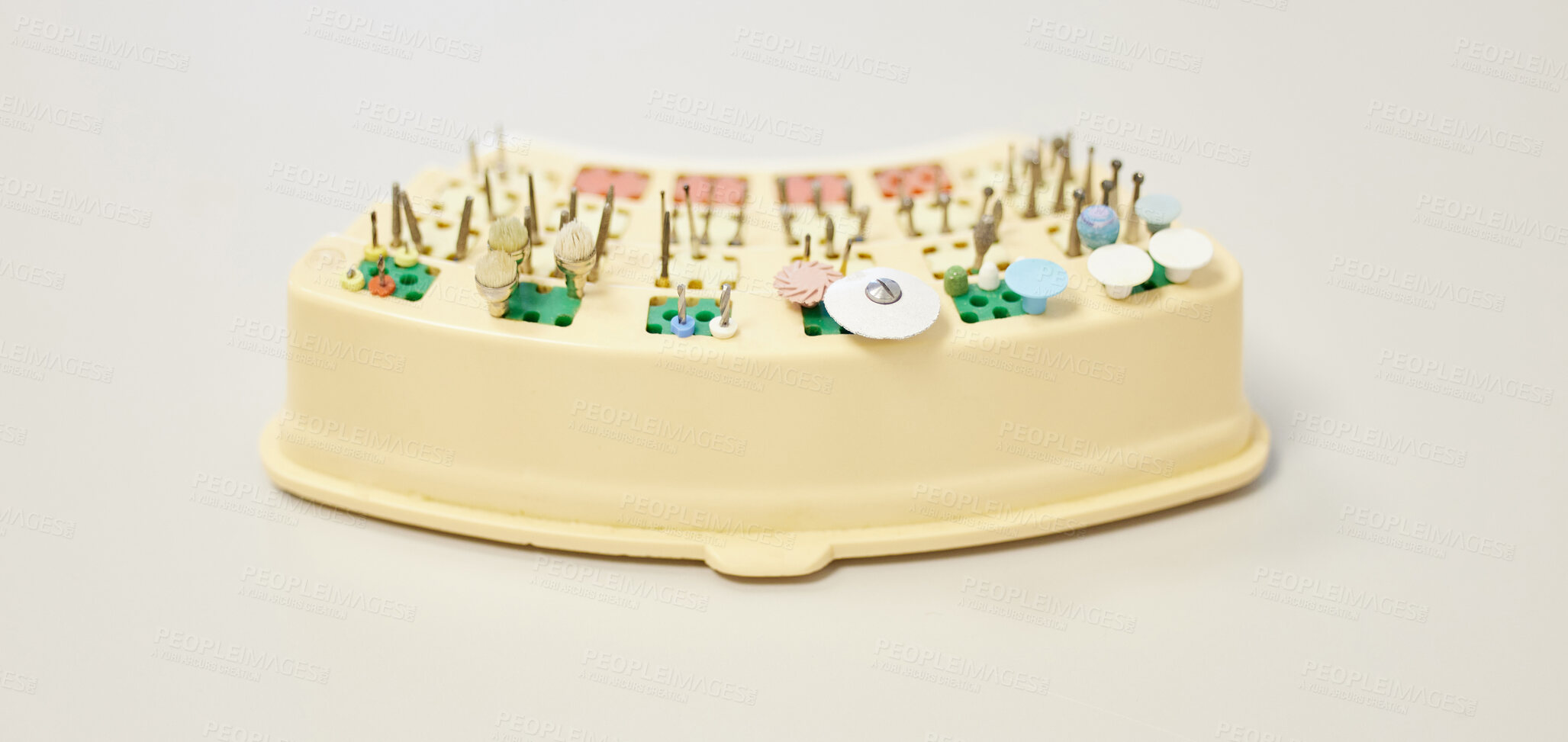 Buy stock photo Shot of various teeth cleaning tools on a table in a dentist’s office