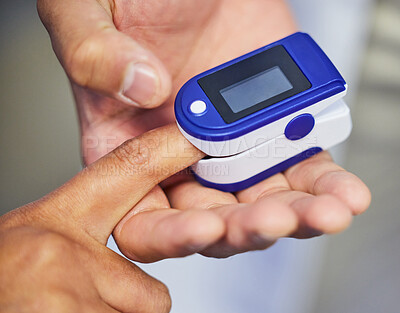 Buy stock photo Shot of an unrecognisable doctor using an oximeter on a patient