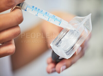 Buy stock photo Shot of an unrecognisable dentist applying teeth whitening gel to a mouth tray with a syringe