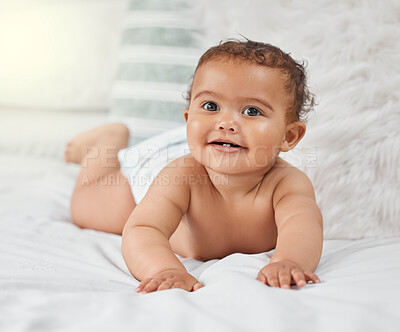 Buy stock photo Child development, cute and innocent with baby on bed in home for growth, having fun or playing. Adorable, balance and security with newborn infant person learning to crawl in bedroom of apartment