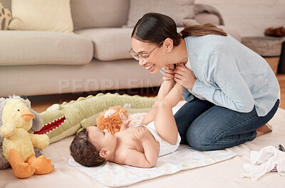 Buy stock photo Happy baby, girl and woman in nursery for diaper change, care and playing in home for development. Cheerful, child and mother for bonding, motor skills and nurture with health, hygiene and comfort