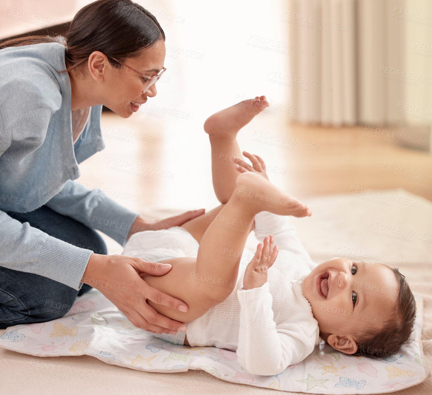 Buy stock photo Happy child, girl and woman in diaper change with care, happiness and playing in home for development. Cheerful, baby and mother for bonding, motor skills and nurture with health, hygiene and comfort