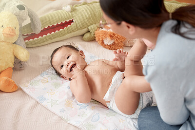 Buy stock photo Cheerful baby, girl and mother in nursery for diaper change, care and playing in home for development. Happy, child and woman for bonding, motor skills and nurture with health, hygiene and comfort