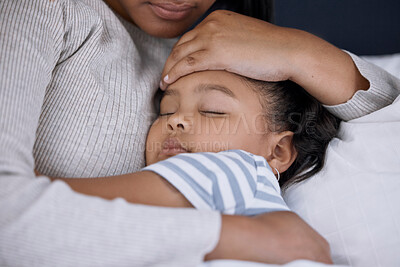 Buy stock photo Shot of an adorable little girl sleeping next to her mother at home