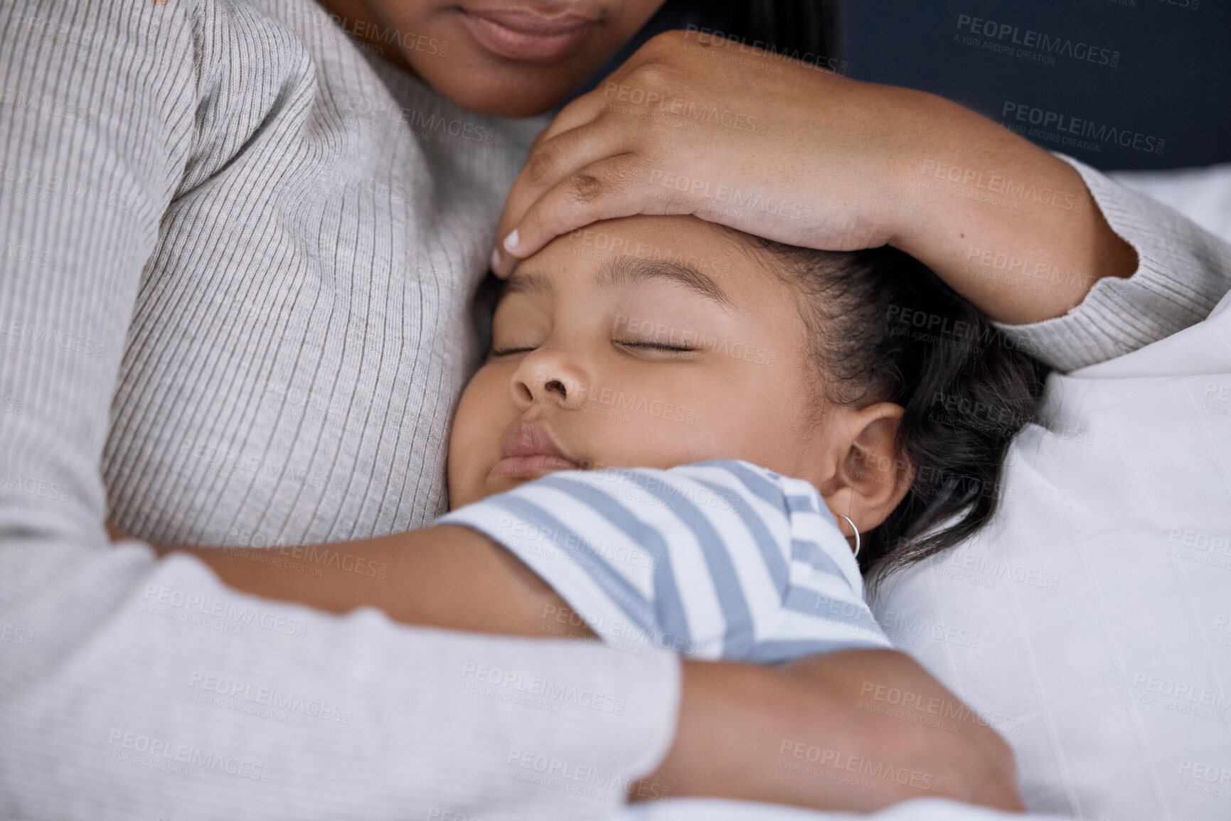 Buy stock photo Shot of an adorable little girl sleeping next to her mother at home