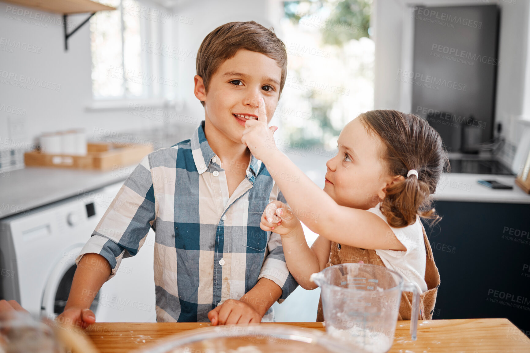 Buy stock photo Baking, family and children with brother, sister and learning cooking in home kitchen. Food, kids and help with girl and boy playing with flour, batter and eggs for muffins or cupcakes together