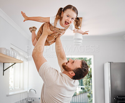 Buy stock photo Shot of a man lifting his adorable little daughter in the air
