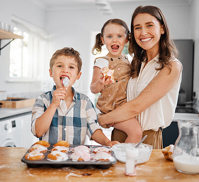 Buy stock photo Shot of a woman baking with her two children at home