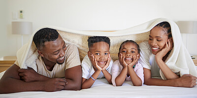 Buy stock photo Happy, parents and children with blanket in bedroom for love, bonding and relax from wake up in morning. Smile, black family and playing for weekend comfort, security and care together at house