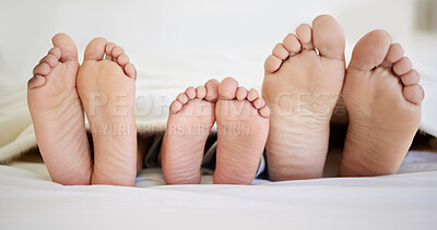 Buy stock photo Feet, family and rest in bedroom, home and sleeping in bed of hotel and ready for pedicure and hospitality. Comfortable, people and parents with child in vacation, relax and together in morning