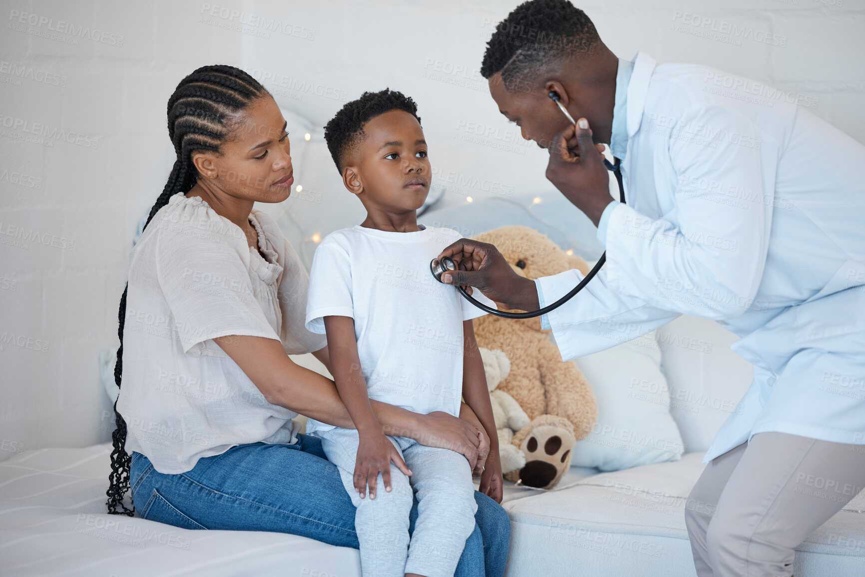 Buy stock photo Black people, mom and son with doctor for checkup, healthcare and support at home. Parent, kid and sick in bedroom with stethoscope for heartbeat or medical diagnosis and emergency on house call