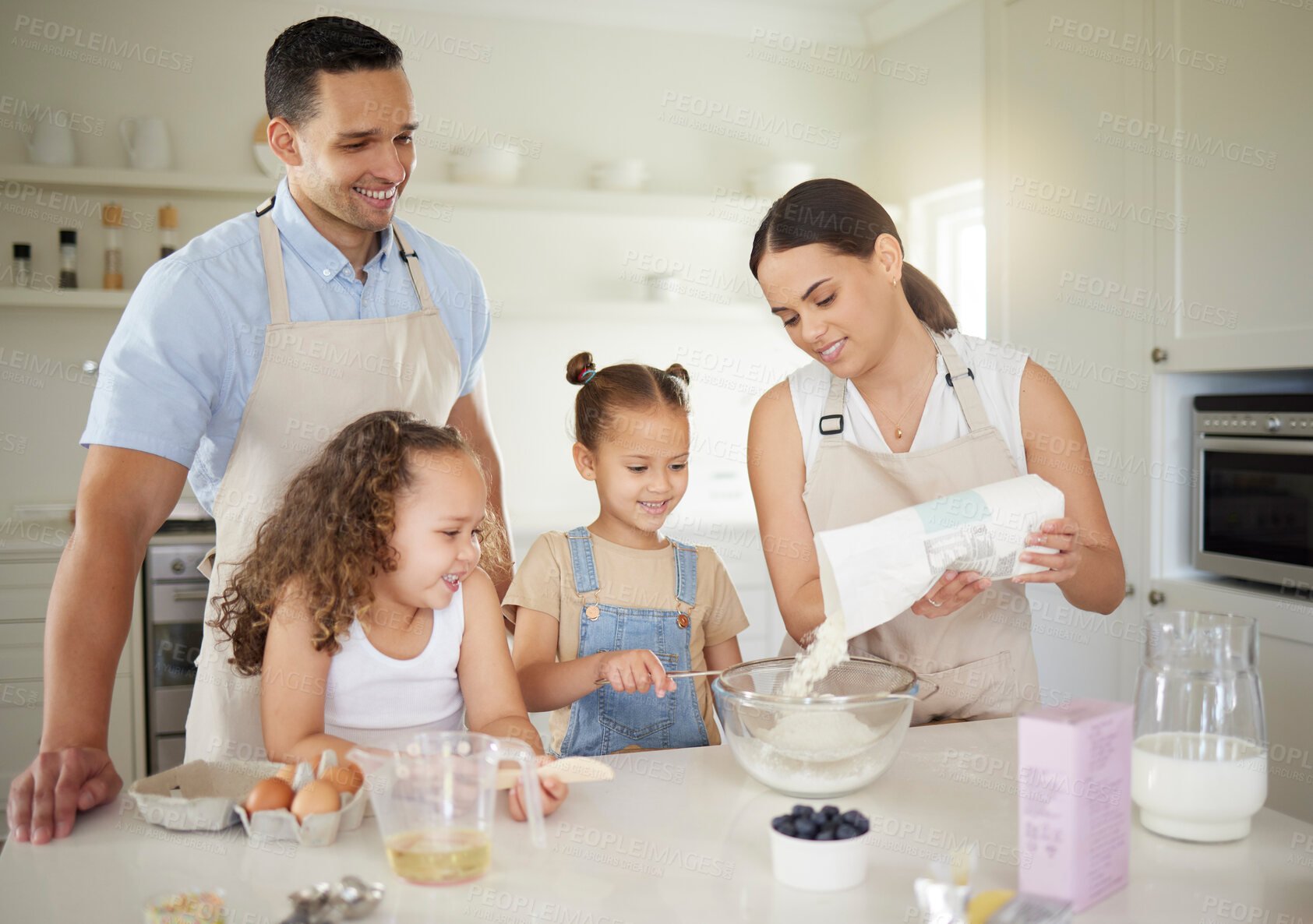 Buy stock photo Family, happy and baking in house for cake, teaching and learning with smile, flour and bowl. Mother, children and man in kitchen for cooking, support  and development with eggs, milk and wheat