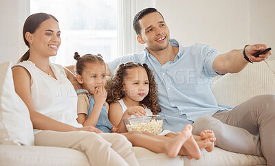 Buy stock photo Remote, family and couch for streaming, tv and series for relax in home living room. Smile, girls and parents for educational show in lounge, mother and dad person for bonding and teaching children