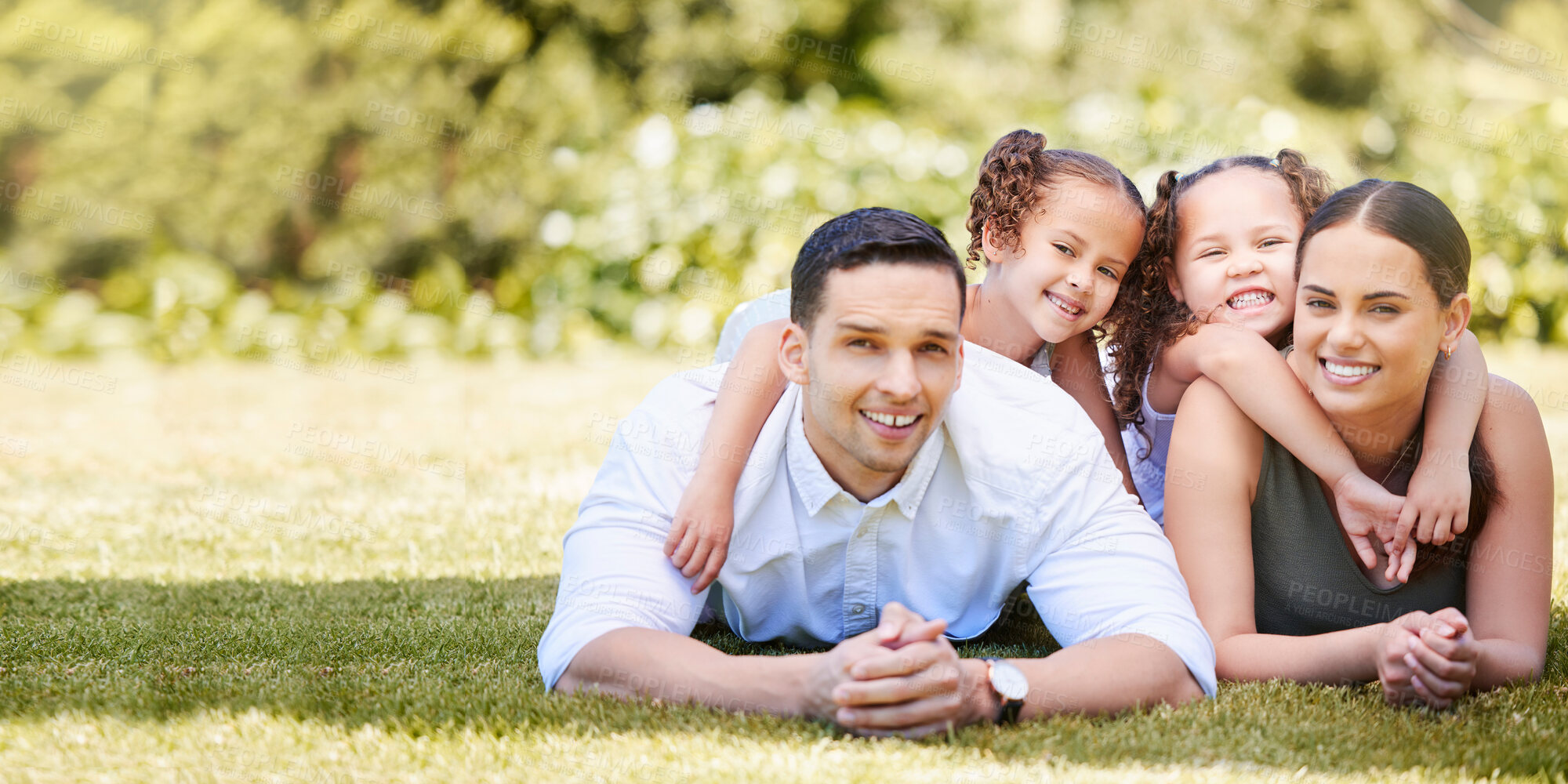 Buy stock photo Portrait, parents and kids with love on grass for weekend adventure, fun and holiday together. Family, man and woman with children in nature for outdoor vacation, break and summer in Costa Rica