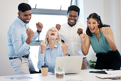 Buy stock photo Shot of a group of businesspeople cheering while using a laptop together in an office