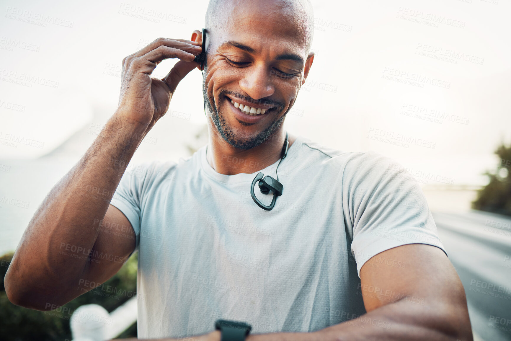 Buy stock photo Shot of a man using his watch to track his pulse while out for a workout