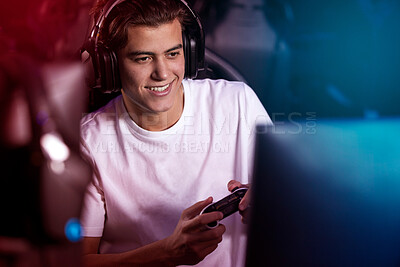 Buy stock photo Computer, headphones and gamer man with control, live stream and smile for esports at night. Content creator, influencer or happy streamer with headset for online fun, video game or playing in home
