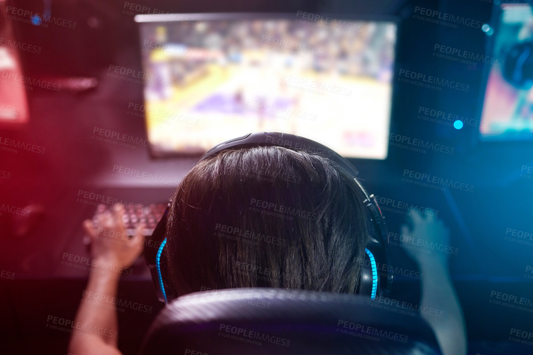 Buy stock photo Computer, screen and gamer with headphones, esports or live stream on monitor from back. Content creator, influencer or streamer with headset for online challenge, video game or playing at night.