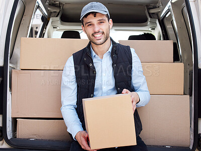 Buy stock photo Portrait of a young delivery man loading boxes from a van