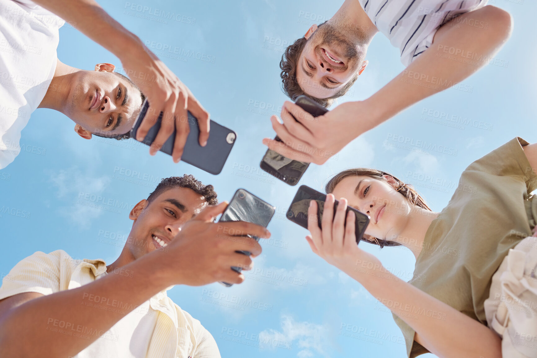 Buy stock photo Students, smartphone and group of people for connection, network and communication as gen z in outdoor. Friends, mobile tech and sharing for social media, internet or digital footprint in circle