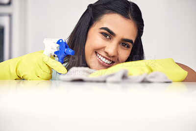 Buy stock photo Cleaner, portrait and cleaning with cloth for furniture, scrub and dirt in house on counter with disinfect spray. Woman, happy and apron with detergent in bottle for dust in home on white background