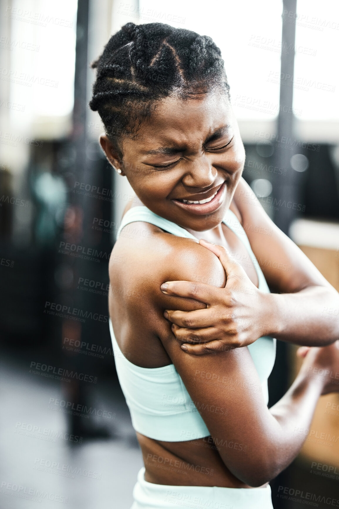 Buy stock photo Female person, shoulder and injury from training at gym with accident or muscle pain for fitness. Fit, black woman and massage arm for medical healthcare after sprain or sore from physical activity  