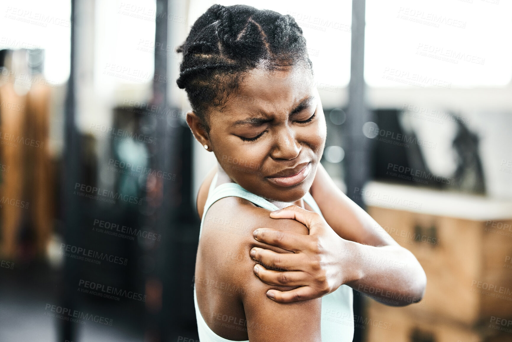 Buy stock photo Black woman, shoulder and injury from training at gym with accident or muscle pain for fitness. Fit, female person and massage arm for medical healthcare after sprain or sore from physical activity  