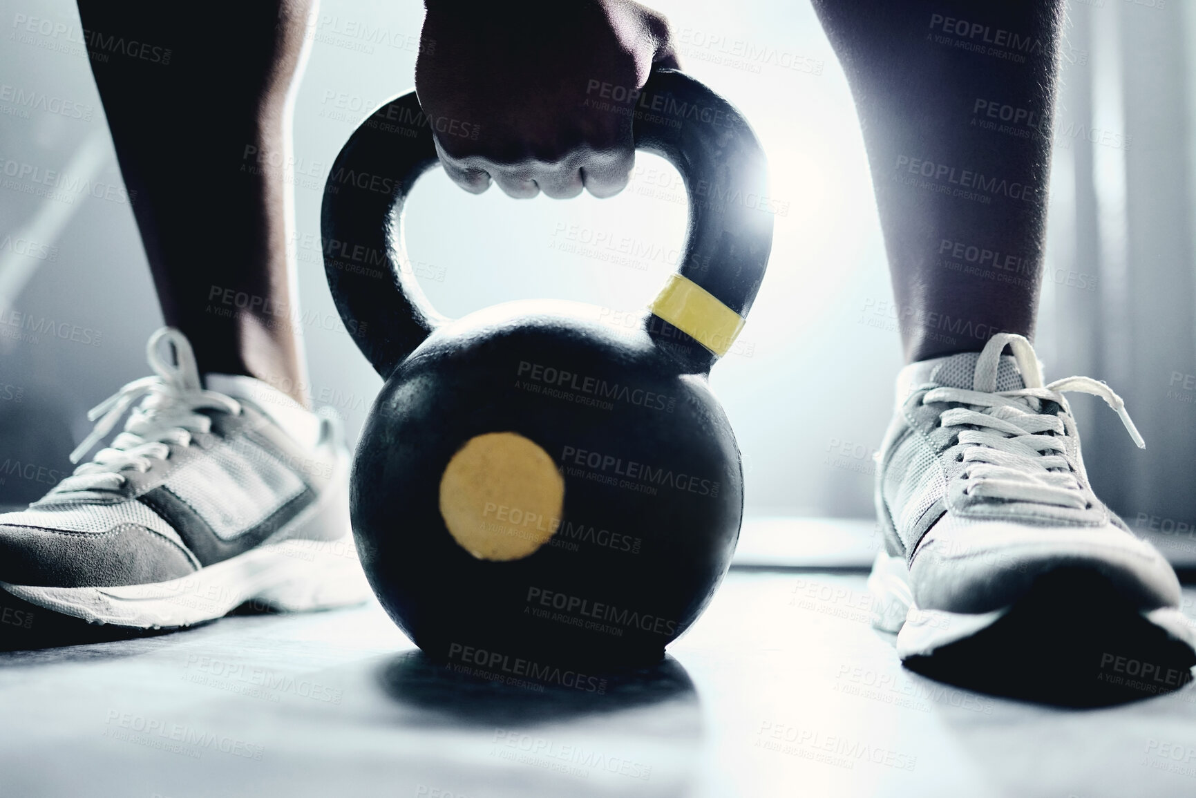 Buy stock photo Person, hand and kettlebell on floor at gym for strength training, fitness and sports challenge. Athlete, bodybuilder and workout equipment on ground for muscle exercise, endurance and body care