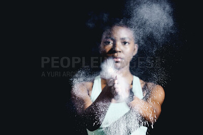 Buy stock photo Portrait, black girl and talcum powder in gym to reduce skin friction, moisture or sweat by dark background. Mockup, Female person or athlete hands for gymnastics, exercise or training in studio