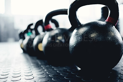 Buy stock photo Fitness, weights and kettlebell on floor of gym for workout, strong and exercise. Metal, iron and performance with sports equipment in training center for weightlifting, wellness and challenge