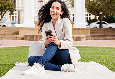 Buy stock photo Shot of an attractive young female university student texting outside on campus during her break