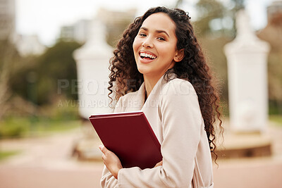 Buy stock photo Portrait of an attractive young female university student standing outside on campus during her break
