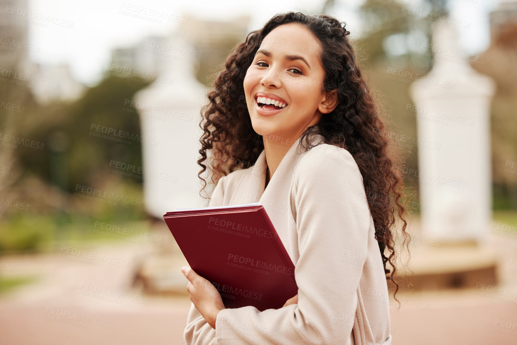 Buy stock photo Portrait of an attractive young female university student standing outside on campus during her break