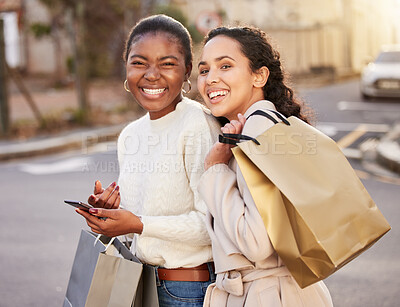 Buy stock photo Smile, women and portrait with smartphone for ecommerce, sale or retail together outdoor by mall. Happy people, paper bag and cellphone for online shopping, discount and deal for fashion or clothes