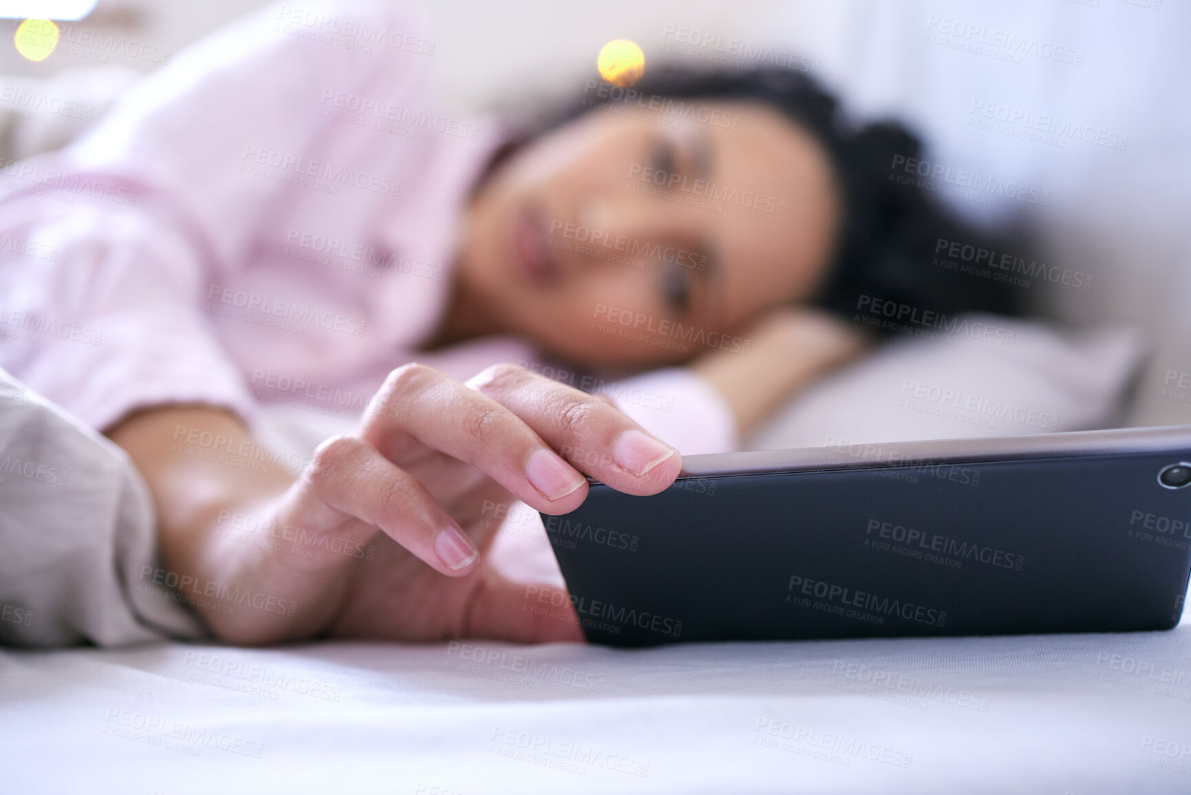 Buy stock photo Woman, smartphone and morning text in bedroom for communication, message and social media. Female person, mobile tech and head on pillow for reading, watching and lazy weekend feeling at home