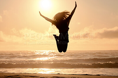 Buy stock photo Freedom, jump and sunset with woman at beach for travel, celebration and winner. Success, summer and silhouette with person jumping in nature for inspiration, energy and purpose with mockup space