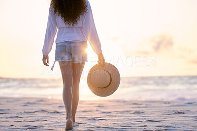 Buy stock photo Beach, sunset and legs of woman walking on holiday, vacation or tropical summer travel outdoor in Hawaii. Back, ocean and feet at sea on sand in nature with hat for adventure, journey or mockup space