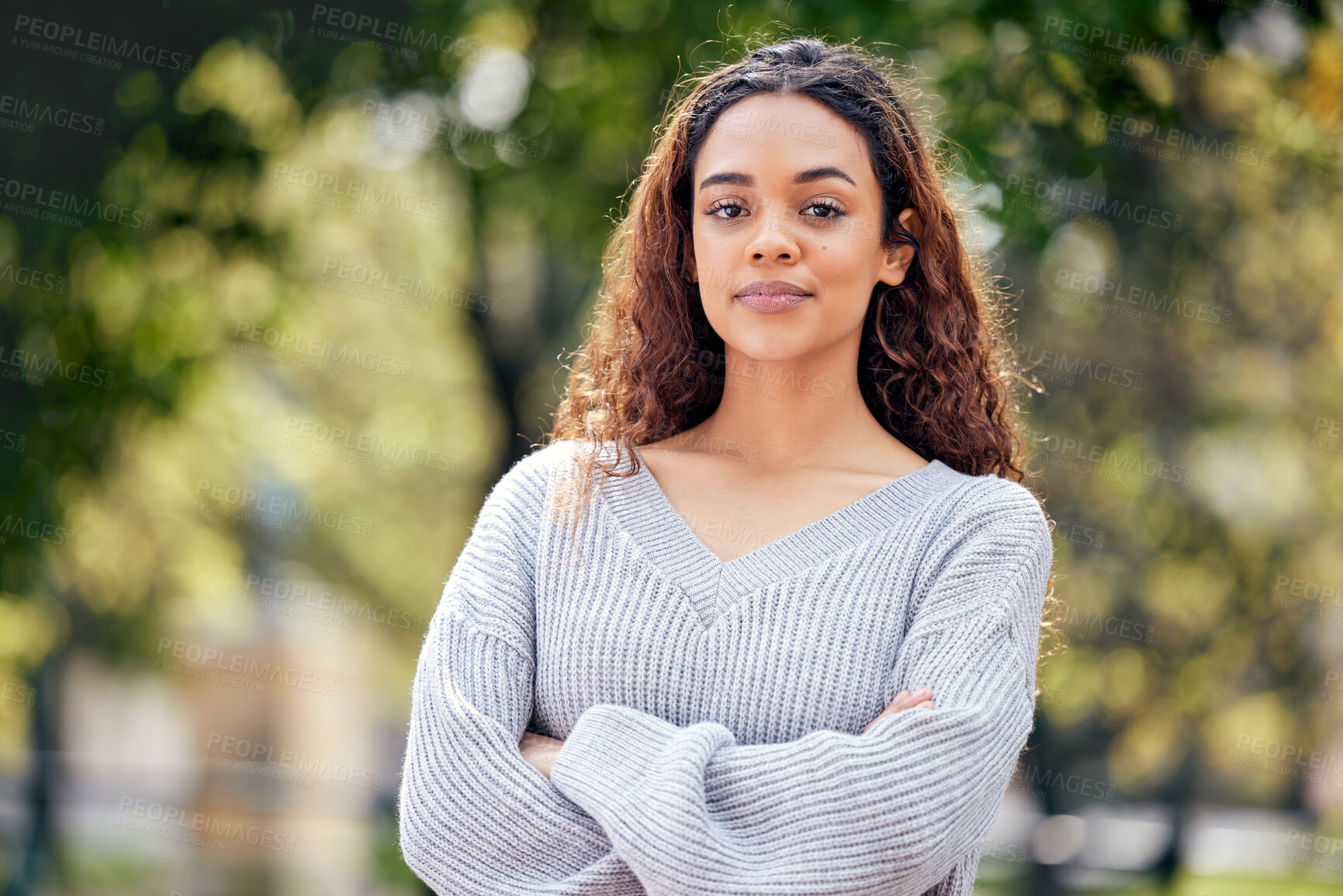 Buy stock photo Portrait, smile and girl with arms crossed in university campus for happiness, confidence or class break. College, student and young woman in nature for education, scholarship or knowledge in Boston