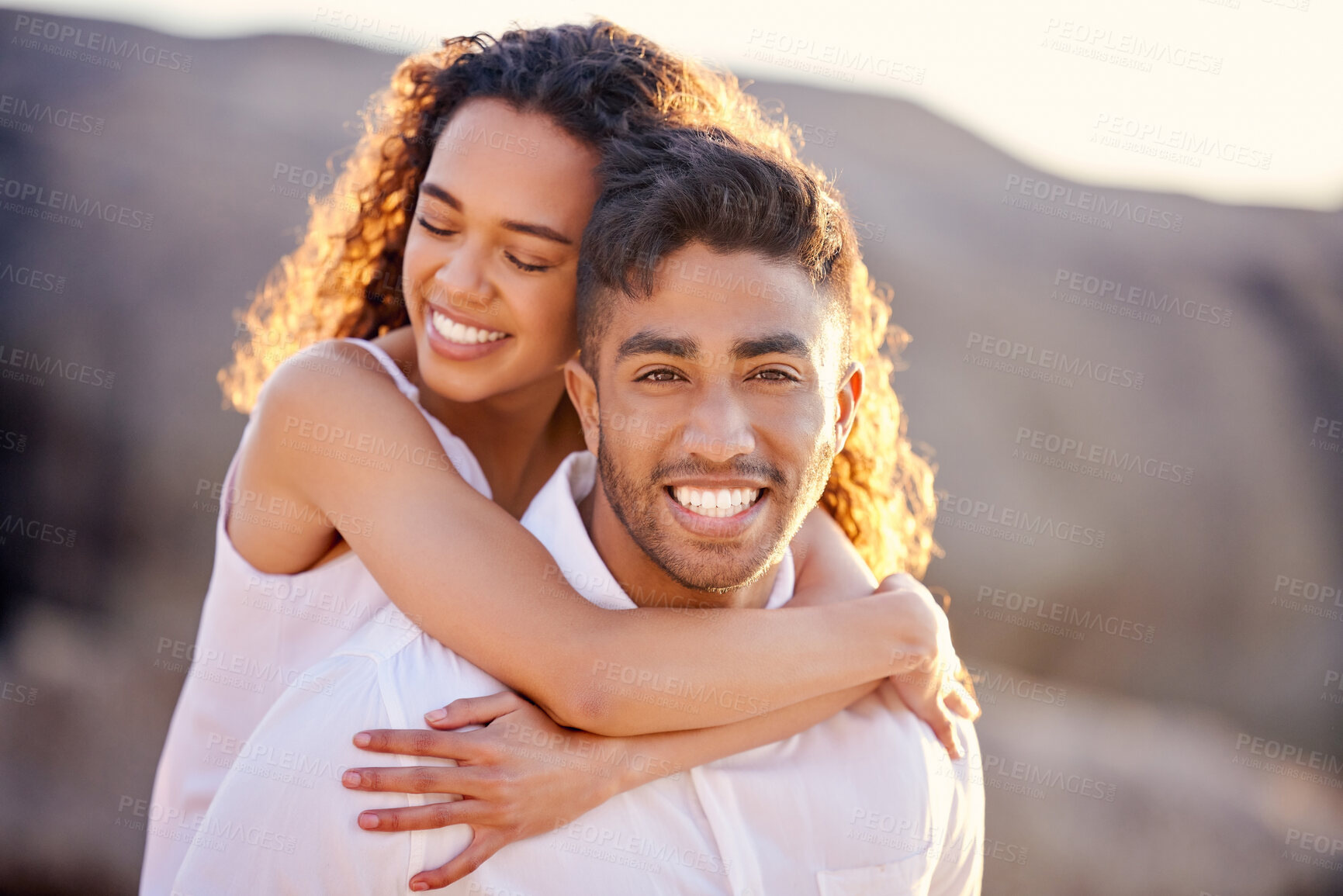 Buy stock photo Portrait, hug and happy couple at beach on holiday, vacation or summer travel outdoor. Face, woman and man piggyback at ocean for adventure date, love or connection for healthy relationship together