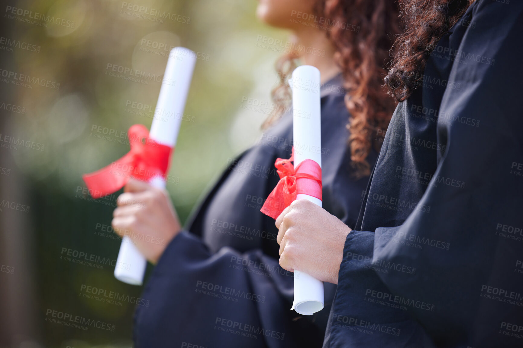 Buy stock photo University, hands and women with diploma at graduation, ceremony or outdoor campus event together. Certificate, pride and students with college achievement for education, opportunity or scholarship