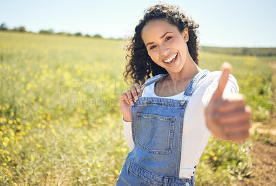 Buy stock photo Portrait, outdoor and countryside with woman, thumbs up and support for earth day, sustainability and sunshine. Face, happy person and girl in field, hand gesture and like with emoji, sign and icon