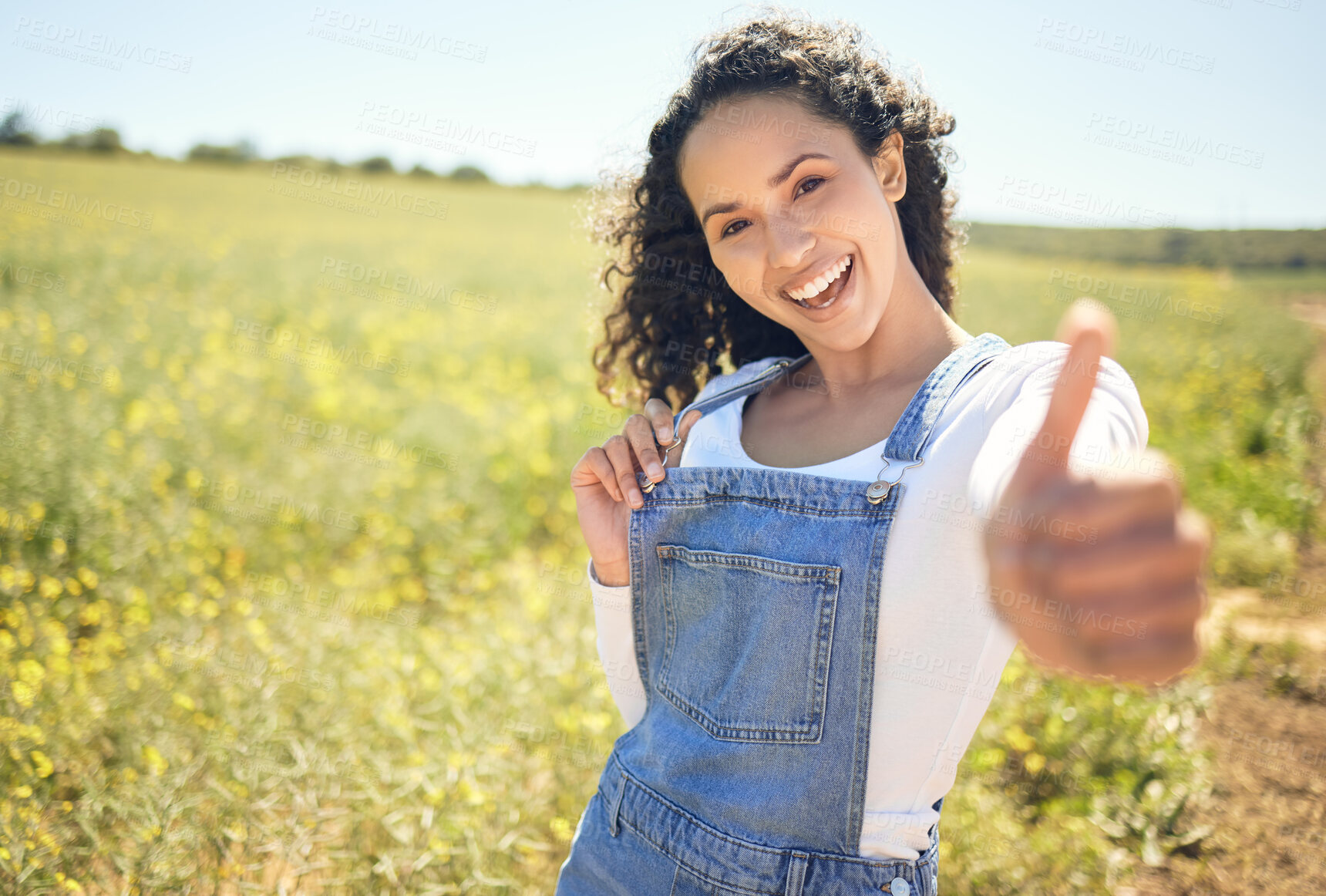 Buy stock photo Portrait, outdoor and countryside with woman, thumbs up and support for earth day, sustainability and sunshine. Face, happy person and girl in field, hand gesture and like with emoji, sign and icon