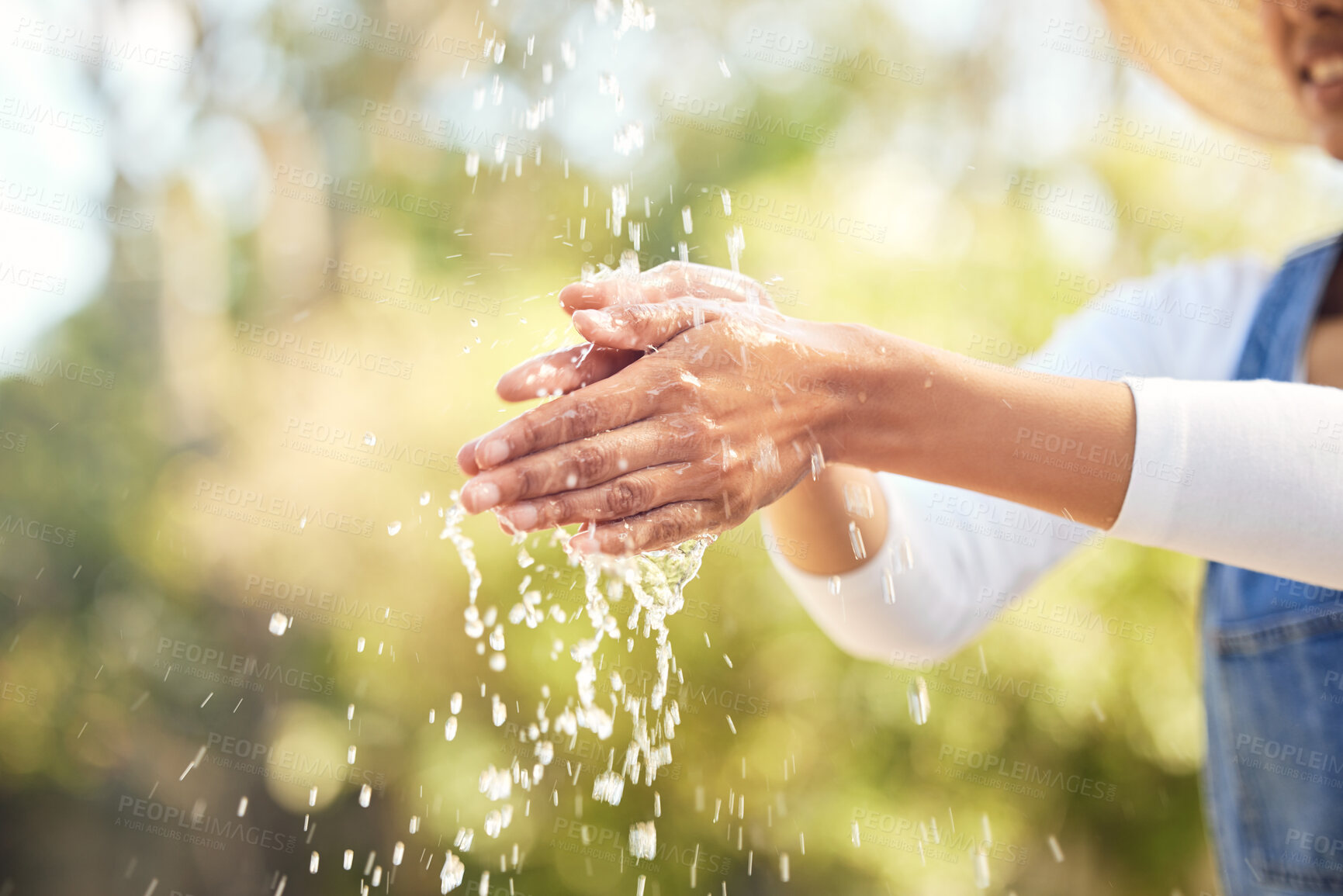 Buy stock photo Woman, outdoor and water for washing hands in nature for germs, health care and sanitation for wellness in countryside. Person, farmer and cleaning in environment with h2o for sustainability and eco.