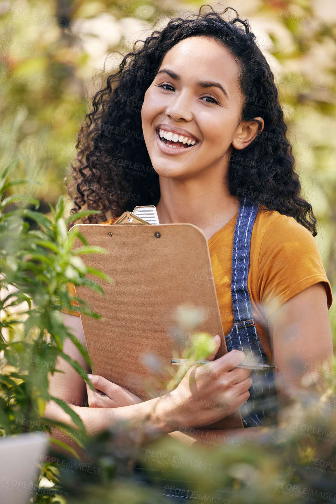 Buy stock photo Clipboard, florist and smile for portrait, woman and entrepreneur with pen for inventory of flowers. Spring, growth and plants for small business, check and order for person, service and outdoor