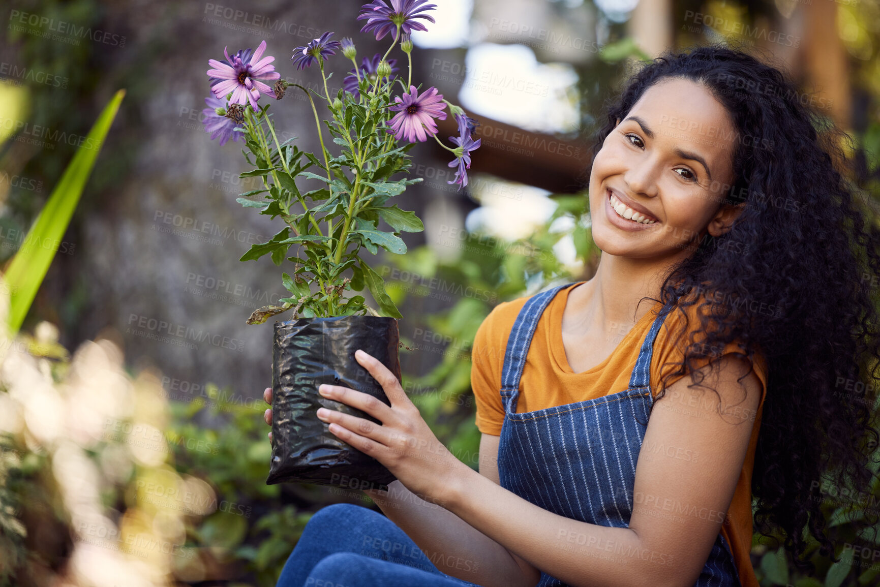 Buy stock photo Planting flowers, portrait and woman in garden for growth, small business or sustainability. Nursery, plants and smile with happy person at gardening startup for eco friendly retail or sale in spring