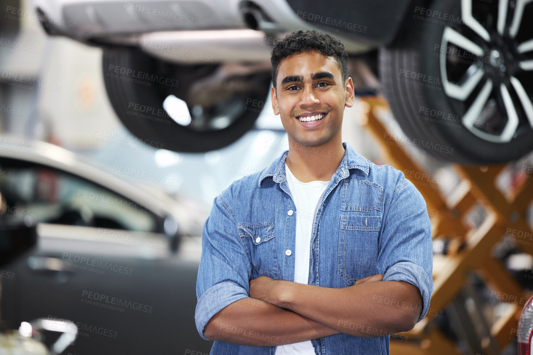 Buy stock photo Portrait, man and smile as mechanic or engineer in automobile, workshop and repairs with confident or pride. Male person, worker and automotive in industry as maintenance, service and expert for cars