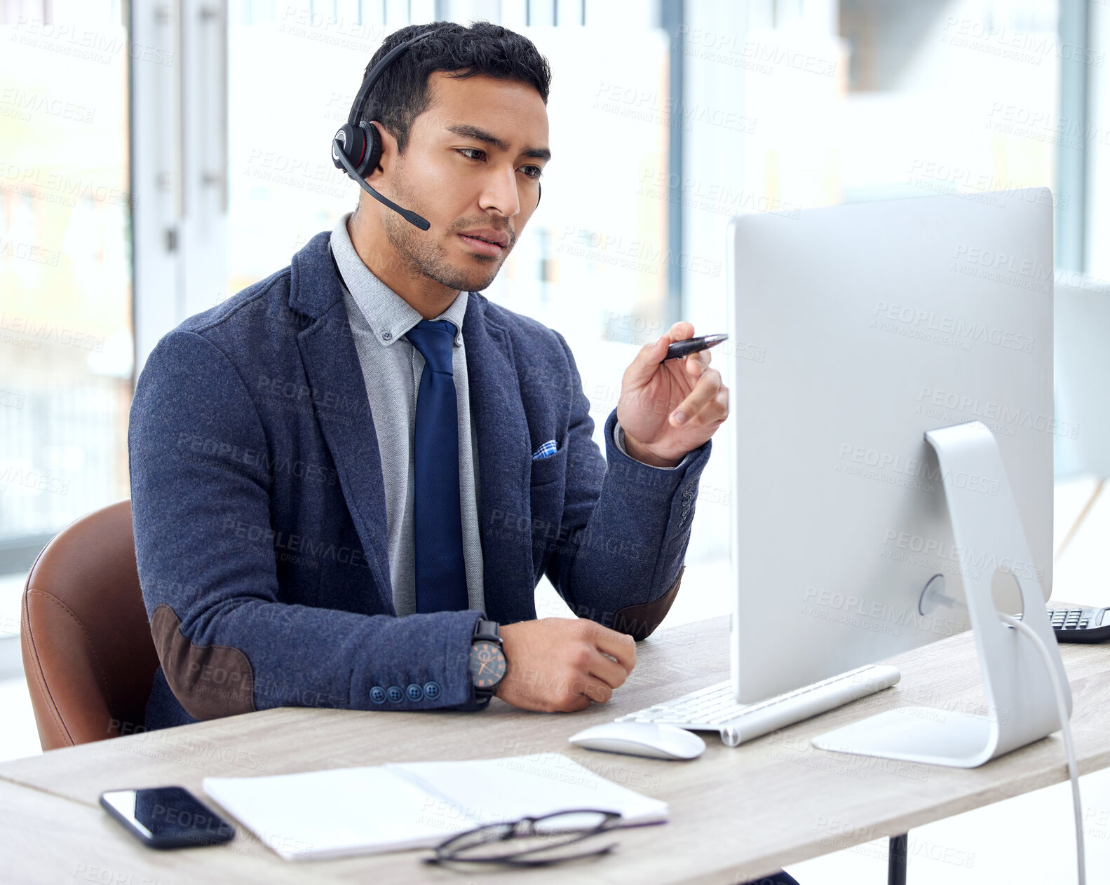 Buy stock photo Call center, computer and business man, IT consultant or technical support agent talk, communication and advice. Helping, callcenter and solution of asian person on desktop for information technology