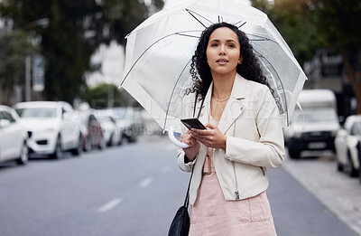 Buy stock photo Woman, city and smartphone with umbrella, thinking or lost with connection, network or insurance. Female person, girl or cellphone with cover, outdoor or walking in the street, search or website info