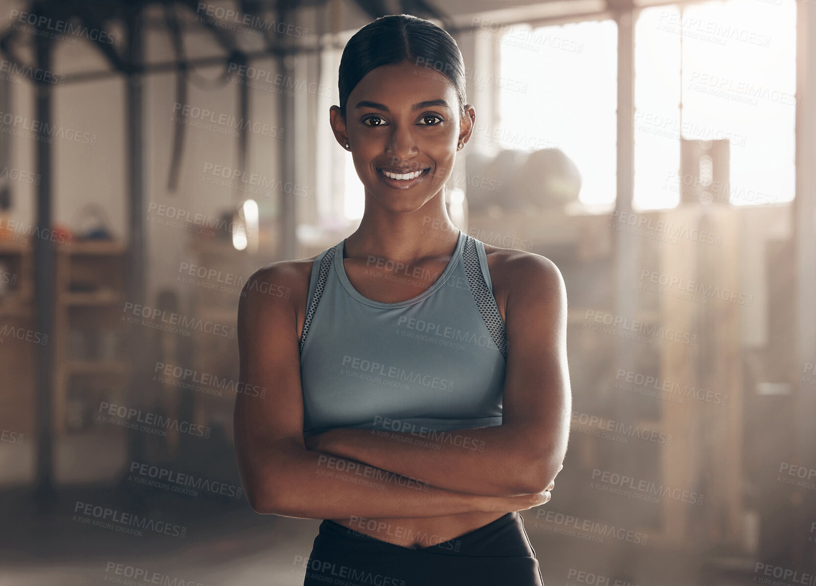 Buy stock photo Crossed arms, fitness and portrait of woman in gym for health, wellness and body workout. Smile, training and female athlete with confidence and pride for muscle exercise in sports center in India.